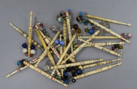 A collection of approximately eighty 19th century named bone and ivory lace bobbins