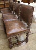 Four oak and leather dining chairs