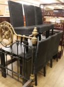 An ebonised dining table and six wickerwork chairs W.180cm