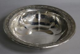 An American sterling silver bowl, circa 1920, having engraved lobed interior and embossed foliate