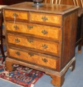 A George I walnut and yew veneered chest of drawers W.91cm