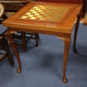 A games table with reversible chess/backgammon top W.76cm