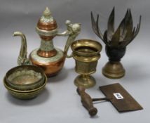 A collection of Indian and Tibetan brassware including a lotus shaped incense burner and a Tibetan