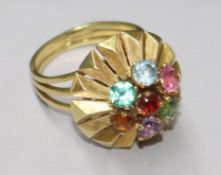 A modernist gem-set cluster ring on triple wire shank, size I.