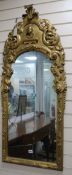 An 18th century and later rococo wall mirror W.55cm