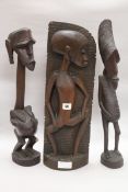 Two Makonde figures and a Papua New Guinea tribal mask and two Makonde figures tallest 95cm