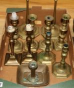 Ten brass candlesticks and a chamberstick, 18th/19th century tallest 54cm