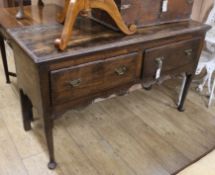 An 18th century oak two drawer dresser W.130cm