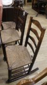 Two ladderback chairs and a spindle back chair