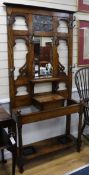 A Victorian Arts & Crafts oak hall stand W.92cm