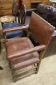 A leather elbow chair and two other chairs