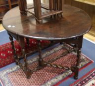An early 18th century oak gateleg table W.128cm with leaves out