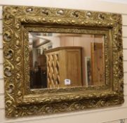 A carved giltwood framed wall mirror W.94cm H.74cm