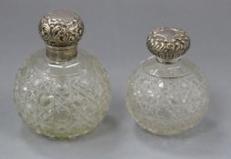 Two late Victorian / Edwardian silver mounted cut glass scent bottles largest 10.5cm