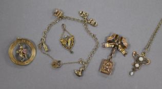 A 9ct gold charm bracelet, a ribbon brooch suspending a book shaped locket, a white opal set Art