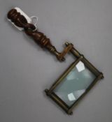 A Victorian carved wood handled brass magnifying glass length 26cm