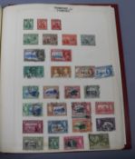 A collection of stamps in a Grafton stamp album, including British Empire and Commonwealth to 1940'