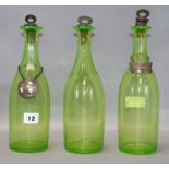 A set of three Victorian uranium glass decanters, with plated labels, the Gin label is silver