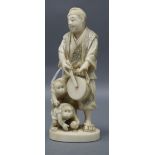 A Japanese ivory okimono of a monkey trainer, early 20th century height 13cm