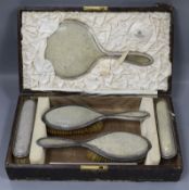 A George V five piece silver and shagreen dressing table set retailed by Goldsmiths & Silversmiths