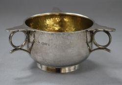 A George V three handled silver porringer, with planished decoration, Chester 1911 2oz