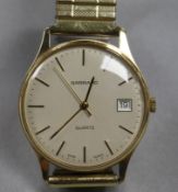 A gentleman's 9ct gold Garrard Quartz wristwatch with date aperture