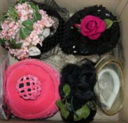 A collection of 1950's and later hats and two hat boxes