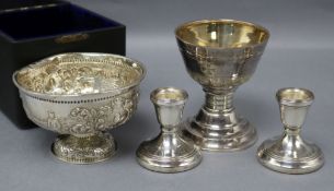 A Victorian silver bowl, a late Victorian communion cup and a pair of later dwarf candlesticks