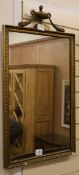 A giltwood and gesso wall wall mirror, with an urn pediment W.48cm