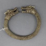 A white metal Chinese dragon bangle