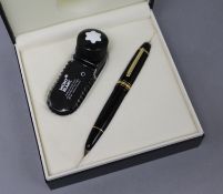 A Mont Blanc fountain pen and travelling inkpot, cased