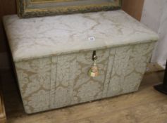 An antique ottoman in distressed damask upholstery W.90cm