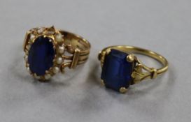 Two unmarked gold gem set dress rings gross 9.8 grams