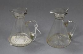 A pair of George V silver mounted glass whisky flagons, Birmingham 1932/33