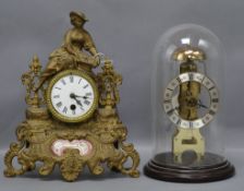 A Hermle, West Germany brass skeleton mantel clock under glass dome and a spelter figural mantel