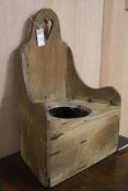 A child's Victorian pine commode chair W.43cm