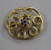 A sapphire set gold scroll brooch 3.5cm, gross 8.9grams