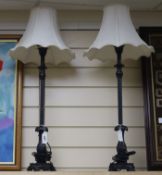 A pair of tall bronzed metal table lamps, with shades height 60cm