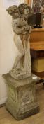 A reconstituted stone garden statue and plinth height 120cm