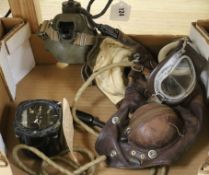 A WWII pilot's flying helmet and a Smiths altimeter MKXVIIA from a Lancaster bomber