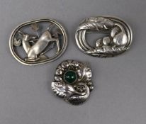 Three Georg Jensen brooches: a sterling deer brooch, model no.256, in Jensen box, a silver oval