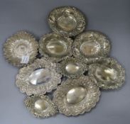 Three white metal trinket dishes, one modelled as a sunflower and six assorted plated trinket