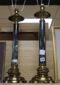 A pair of gilt metal and green marble columnar table lamps, with shades over height 56cm