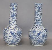 A pair of Chinese blue and white vases height 25cm