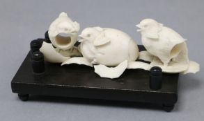 A Japanese Meiji period ivory carving of three chicks, one emerging from an egg width 13cm