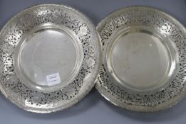 A near pair of Middle Eastern white metal dishes with pierced decoration and scroll feet 34.5cm
