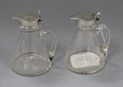 A pair of George V silver mounted glass whisky flagons, Birmingham 1913