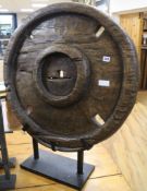 A Thai carved wood wheel on stand diameter 75cm