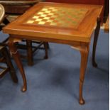 A games table with reversible chess/backgammon top W.76cm