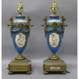 A pair of Sevres-style urns with ormolu mounts (converted to electricity) overall height 38cm